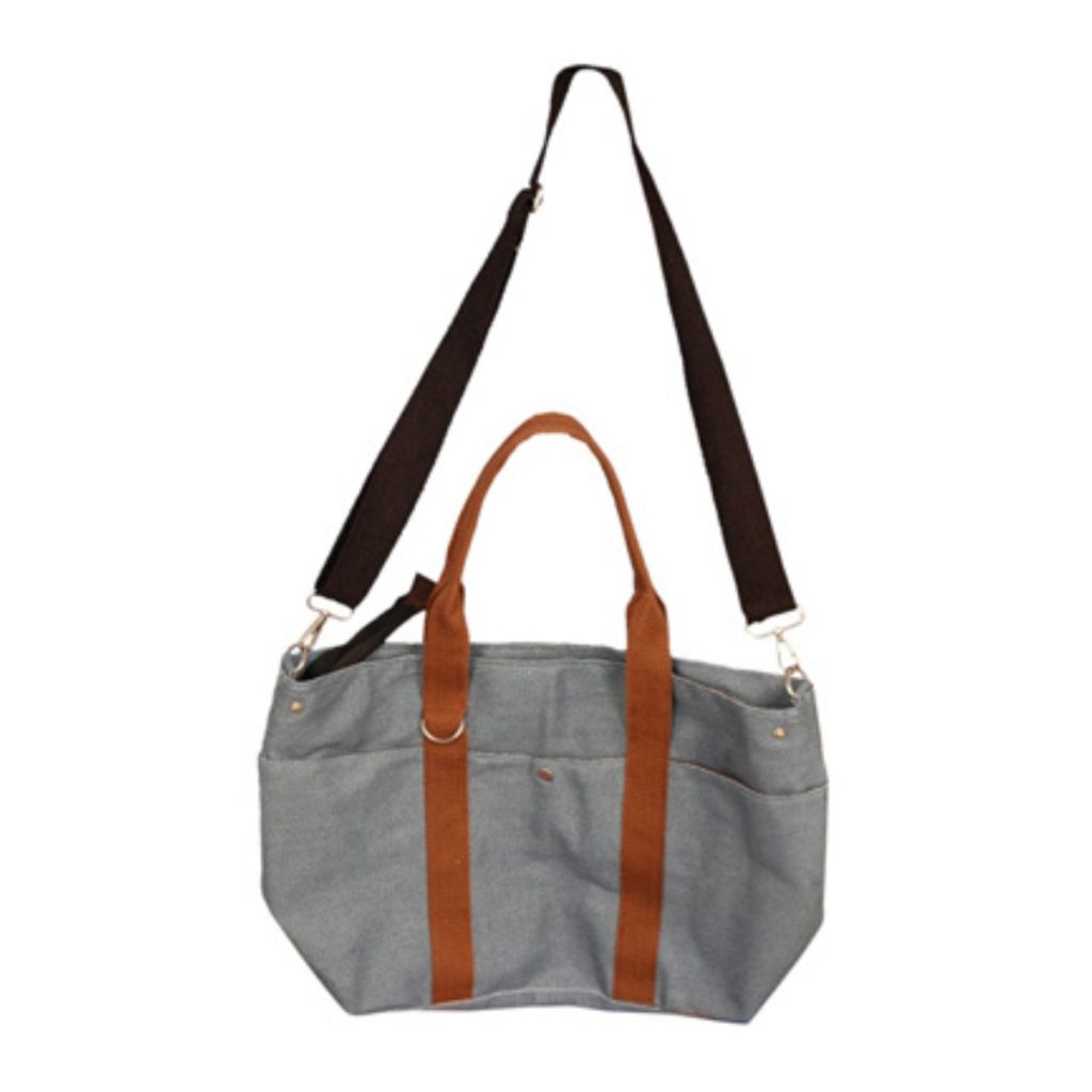 Beige jute tote bag with side pockets and wide brown handles