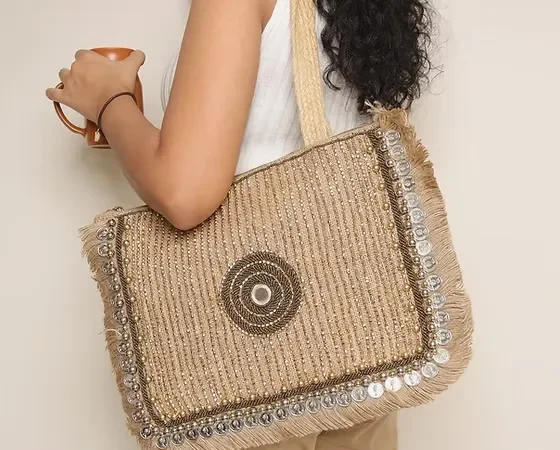 Decorative jute shoulder bag with metallic embellishments